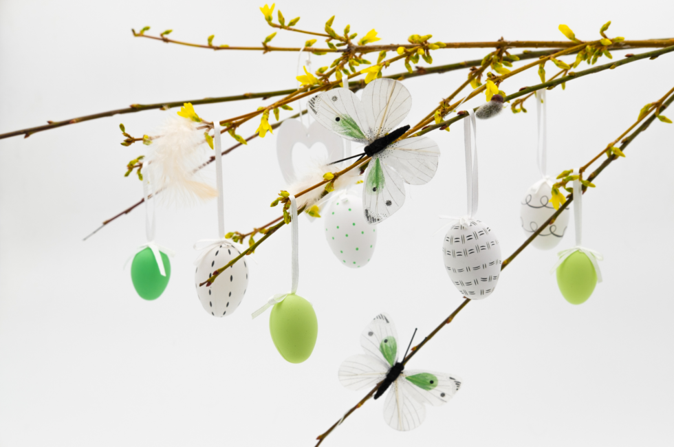 Easter decor branches with green and white egg ornaments