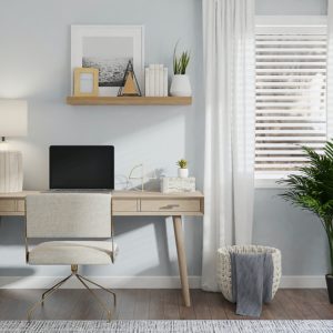 neutral-toned home office with desk essentials, situated to the left of a window